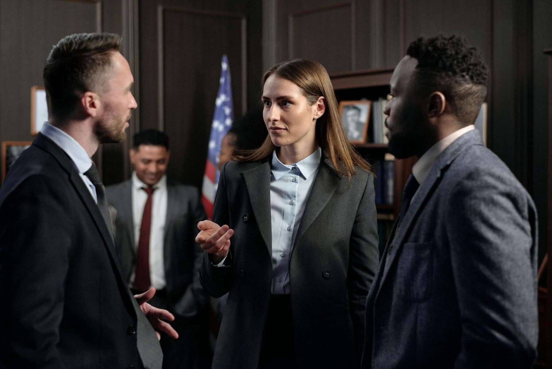 Group of business people having a conversation at work